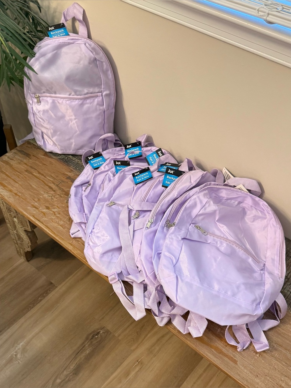 Bulk set of 10 New Light purple small nylon backpacks. New with tag.
